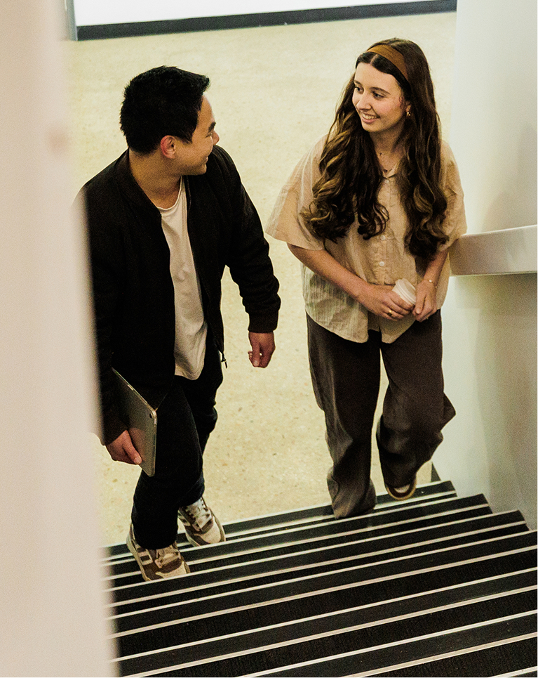 Students talking in the hallway between sessions