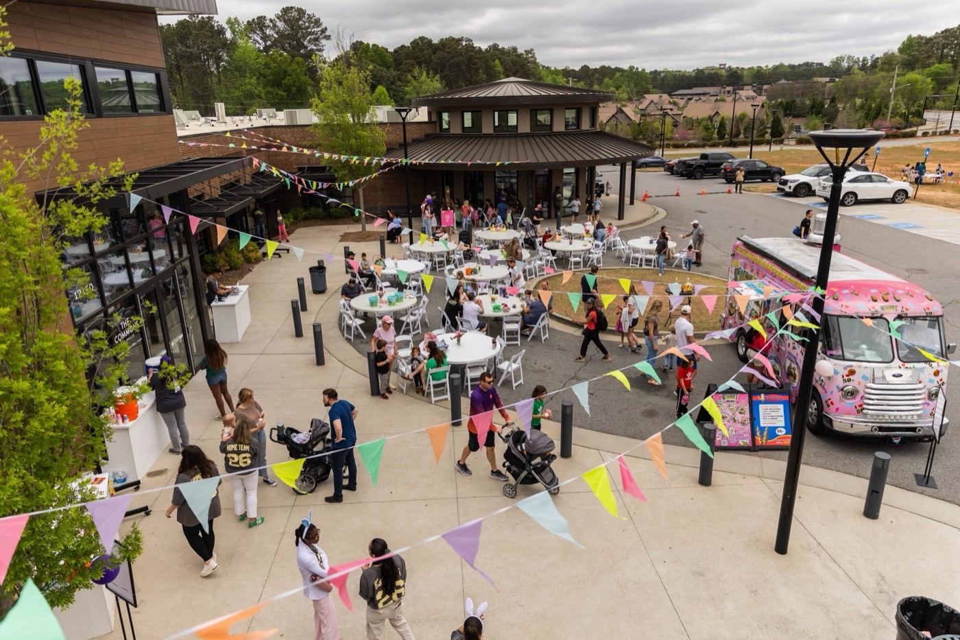 An outdoor community day at The Commons — the Futures Alpharetta building, right by Avalon