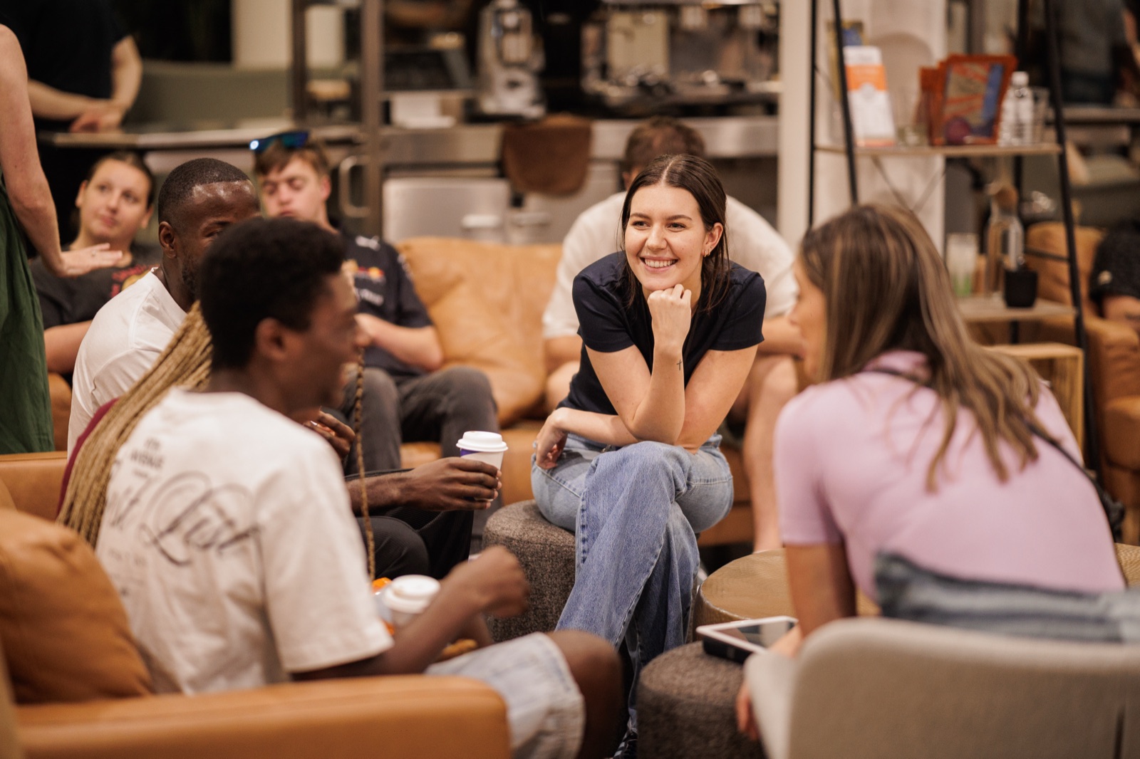 A diverse group of friends hanging out together at Futures Alpharetta