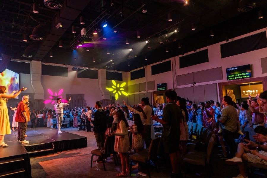 A diverse, multigenerational congregation worshipping together at Futures Alpharetta