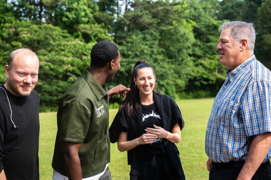 A multicultural group of friends chatting outdoors at Futures Kennesaw